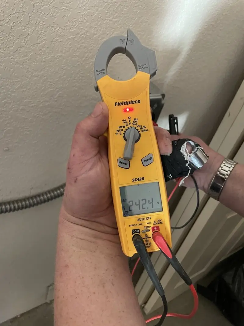 Voltage testing with clamp meter during Outlet Installation in South Alamo